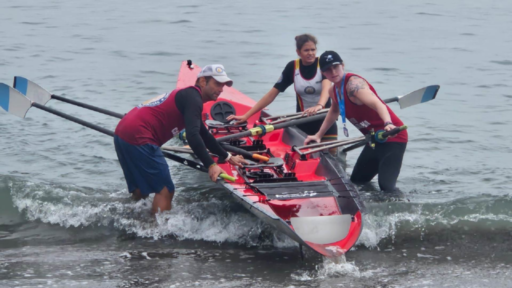 Davide Riccardi holds a boat