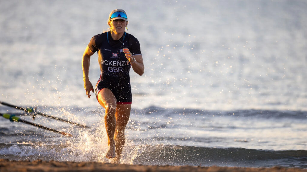Laura Mckenzie runs along the shore.