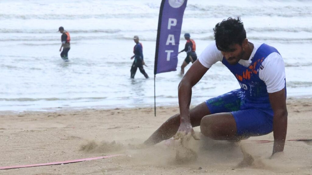 Ravi dives for the finish line.