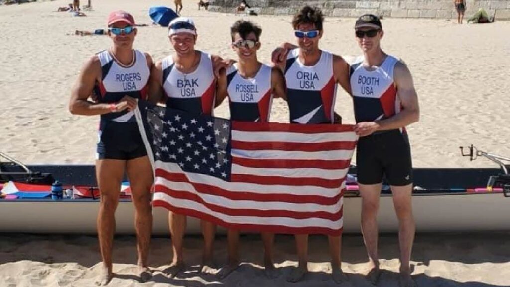 Marc Oria, Kory Rogers, Chris Bak, Bennett Rossell and Ben Booth with the U.S. flag.