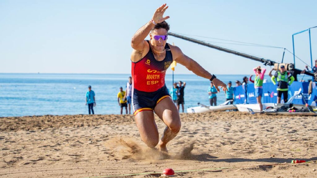 Ander Martín dives for the line (and the buzzer) during the 2026 World Rowing Beach Sprint Finals