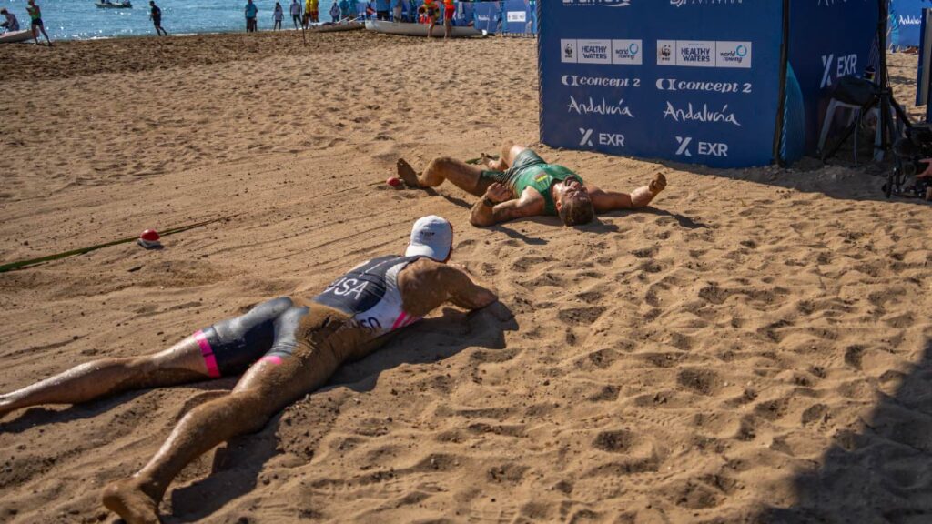 Lithuania's Dominykas Jancionis and the USA's Chris Bak after diving for the line in 2025