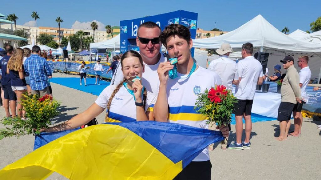 Kseniia Ratushniak, Maksym Sivko and coach Serhii Chykanov